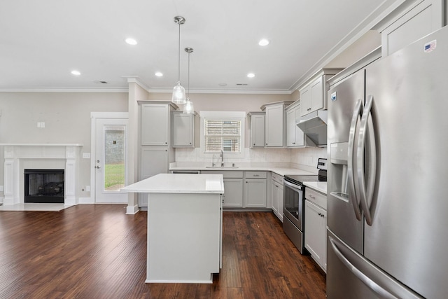 1412 Wrangler Ln, Smyrna, TN 37167 - kitchen featuring appliances with stainless steel finishes, ornamental molding, light countertops, backsplash, and under cabinet range hood