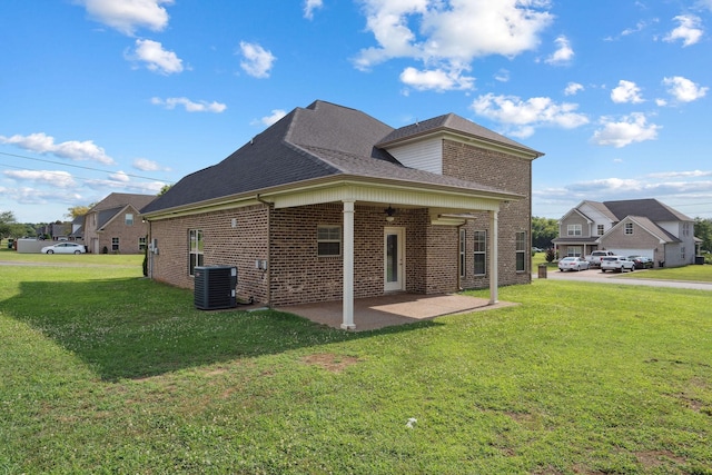 1412 Wrangler Ln, Smyrna, TN 37167 - view of home's exterior with ceiling fan, brick siding, a yard, and a patio area