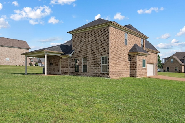 1412 Wrangler Ln, Smyrna, TN 37167 - rear view of property featuring brick siding, a lawn, and driveway