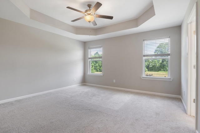 215 Ruth Way, Spring Hill, TN 37174 - unfurnished room featuring light colored carpet, a ceiling fan, and a raised ceiling