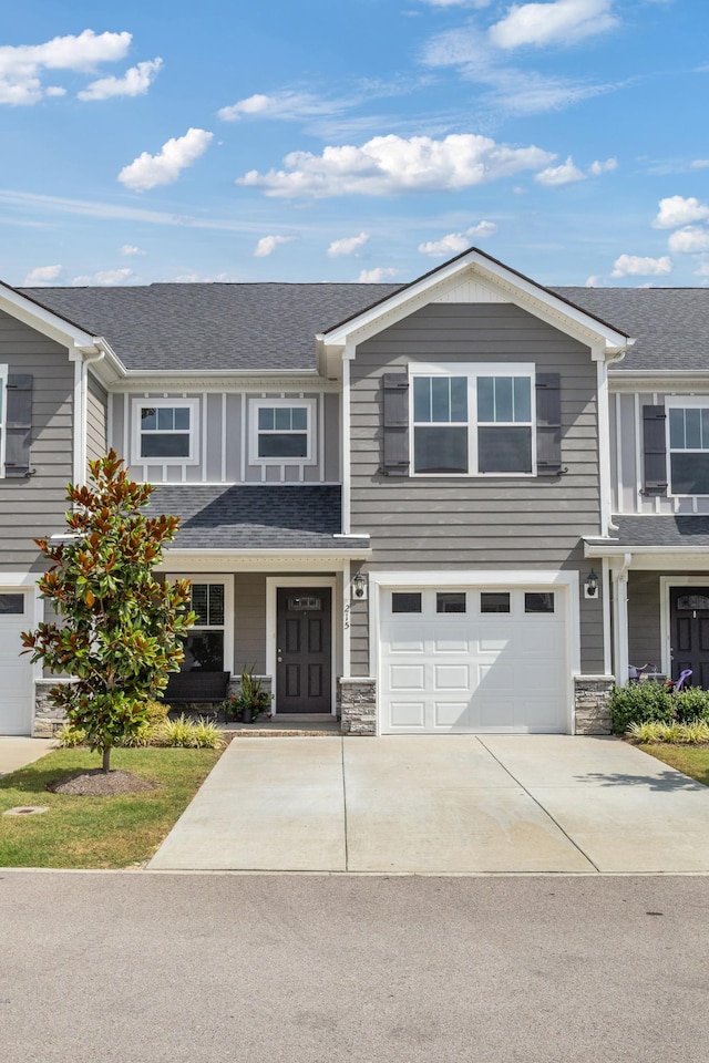 215 Ruth Way, Spring Hill, TN 37174 - craftsman inspired home with concrete driveway, an attached garage, roof with shingles, and stone siding