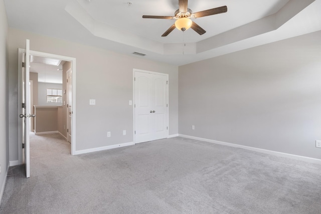 215 Ruth Way, Spring Hill, TN 37174 - unfurnished bedroom featuring attic access, carpet flooring, a tray ceiling, and ceiling fan