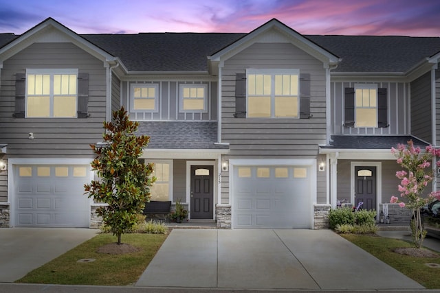 215 Ruth Way, Spring Hill, TN 37174 - view of front facade with an attached garage, covered porch, concrete driveway, and stone siding
