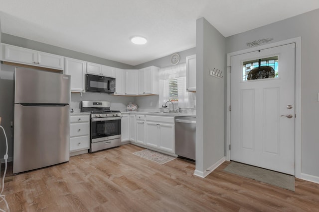 109 Saint Margarett Cir, Columbia, TN 38401 - kitchen featuring stainless steel appliances, light countertops, and white cabinetry