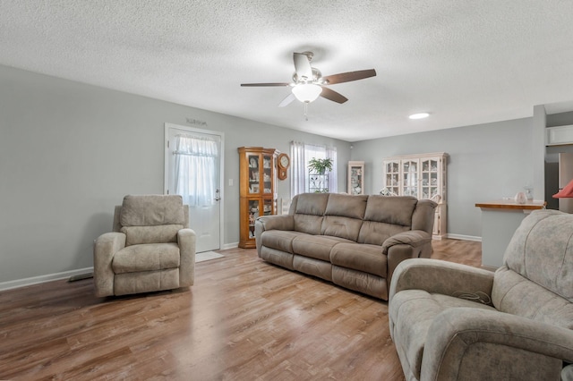 109 Saint Margarett Cir, Columbia, TN 38401 - living room with ceiling fan, light wood-style floors, and a textured ceiling