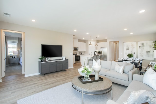 1768 Williamsport Lndg, Columbia, TN 38401 - living area featuring light wood-type flooring and recessed lighting