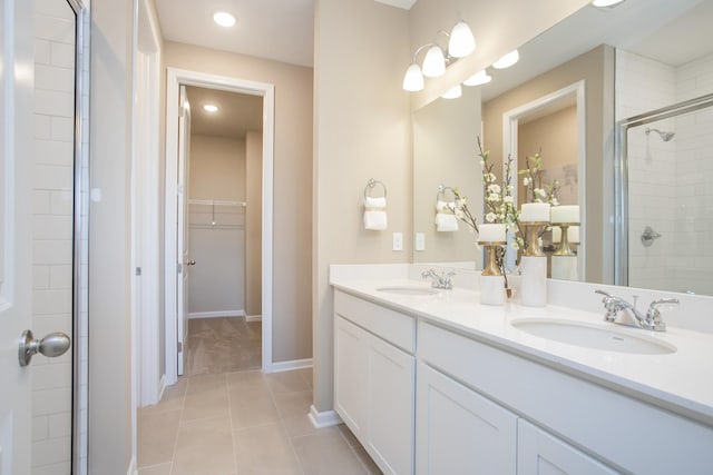 1768 Williamsport Lndg, Columbia, TN 38401 - full bathroom with a spacious closet, double vanity, tiled shower, tile patterned floors, and recessed lighting