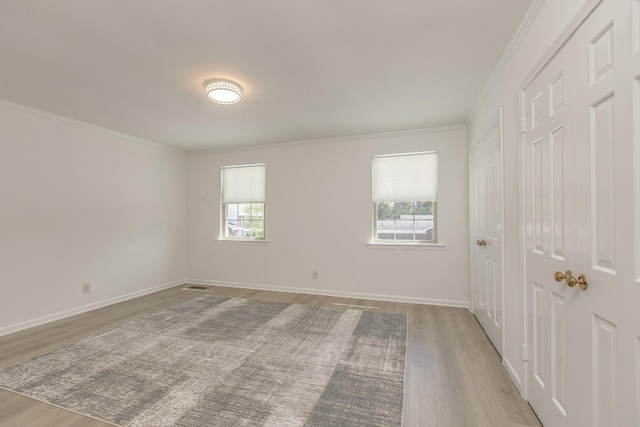 1002 E Northfield Blvd Unit A102, Murfreesboro, TN 37130 - unfurnished bedroom featuring wood finished floors, multiple closets, and ornamental molding