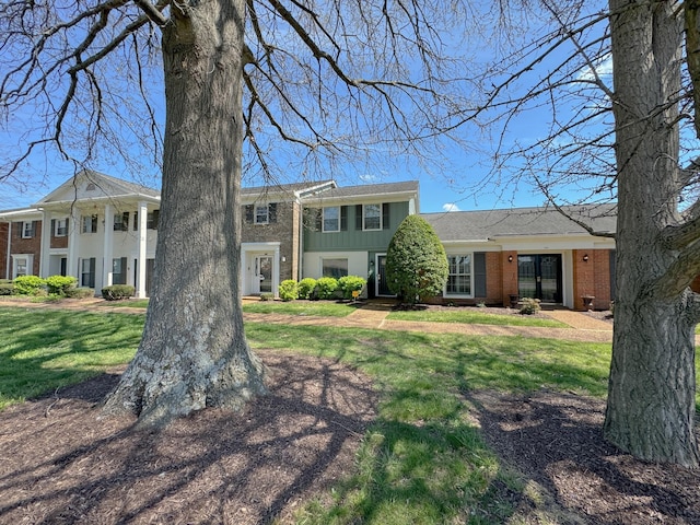 1002 E Northfield Blvd Unit A102, Murfreesboro, TN 37130 - view of front of home with brick siding and a front lawn