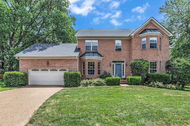 205 Seneca Ct, Franklin, TN 37067 - traditional home featuring concrete driveway, brick siding, a front yard, and a garage