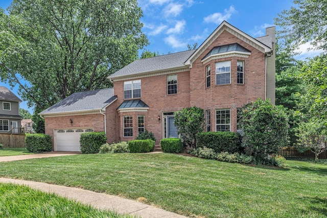 205 Seneca Ct, Franklin, TN 37067 - view of front of property featuring brick siding, a chimney, driveway, an attached garage, and roof with shingles