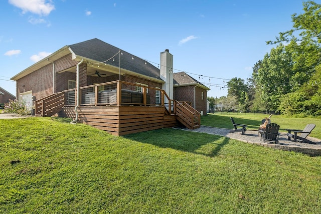 163 Bland Dr, Mount Juliet, TN 37122 - rear view of property featuring stairway, brick siding, ceiling fan, a fire pit, and a lawn