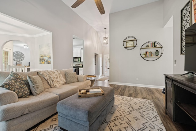 163 Bland Dr, Mount Juliet, TN 37122 - living area featuring a ceiling fan, arched walkways, dark wood-type flooring, and crown molding