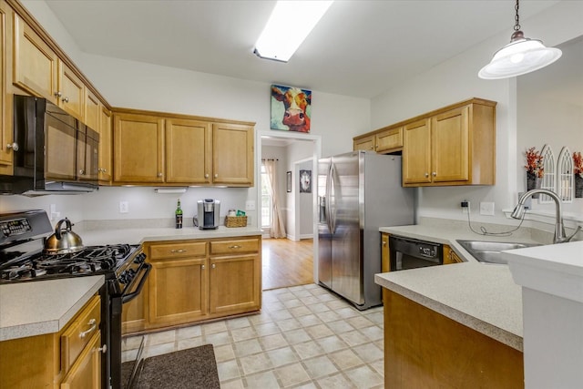 1301 Saybrook Xing, Thompsons Station, TN 37179 - kitchen featuring black appliances, light countertops, light flooring, a peninsula, and pendant lighting