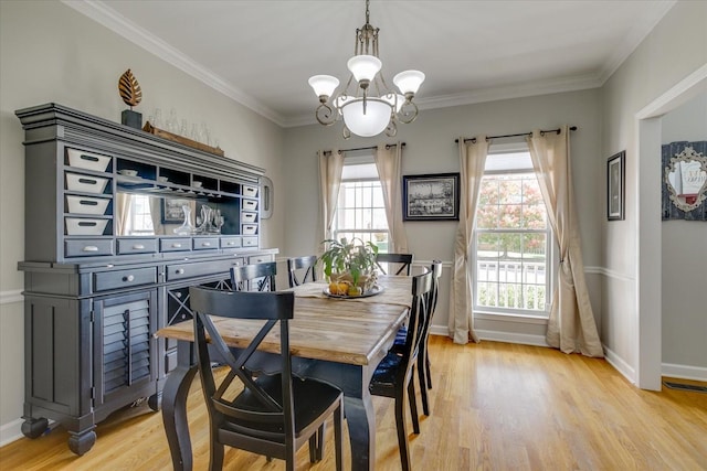 1301 Saybrook Xing, Thompsons Station, TN 37179 - dining space with a chandelier, light wood-style floors, and ornamental molding