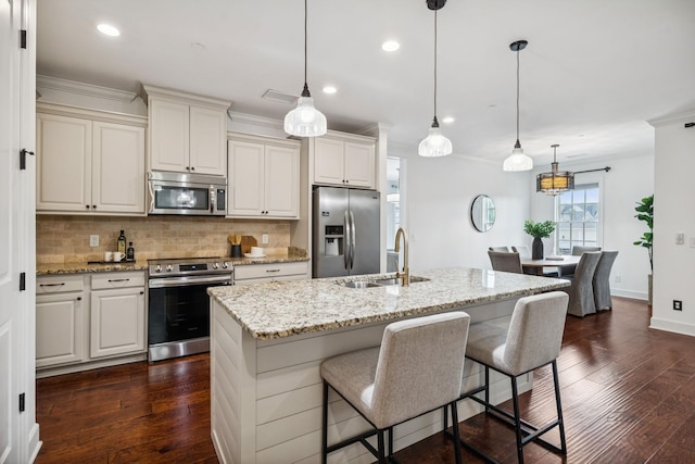 6000 Keats St Unit 202, Franklin, TN 37064 - kitchen with appliances with stainless steel finishes, backsplash, a kitchen bar, crown molding, and dark wood-style floors