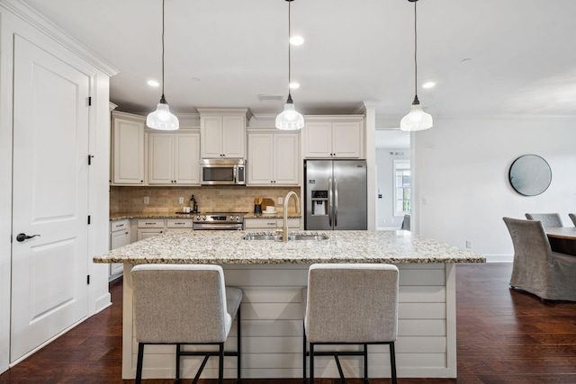 6000 Keats St Unit 202, Franklin, TN 37064 - kitchen with appliances with stainless steel finishes, tasteful backsplash, light stone counters, a breakfast bar, and recessed lighting