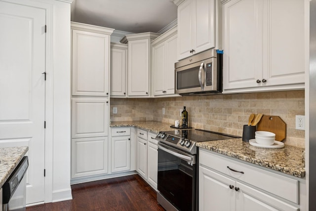 6000 Keats St Unit 202, Franklin, TN 37064 - kitchen with stainless steel appliances, dark wood finished floors, backsplash, white cabinetry, and light stone countertops