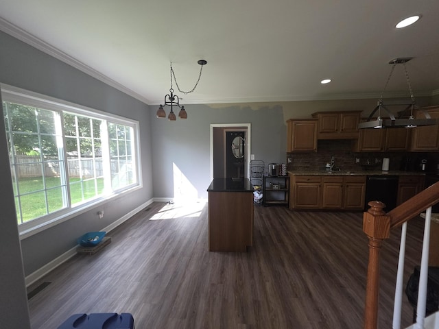 1215 Chapmans Retreat Dr, Spring Hill, TN 37174 - kitchen with tasteful backsplash, black dishwasher, ornamental molding, dark wood finished floors, and decorative light fixtures