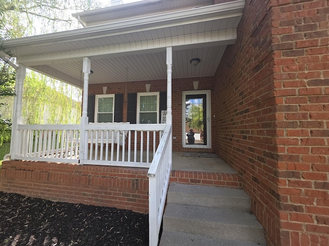 1215 Chapmans Retreat Dr, Spring Hill, TN 37174 - property entrance with a porch and brick siding