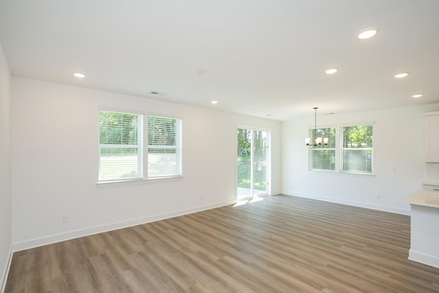 137 W Cassa Way, Mount Juliet, TN 37122 - unfurnished living room with a chandelier, light wood-style flooring, and recessed lighting