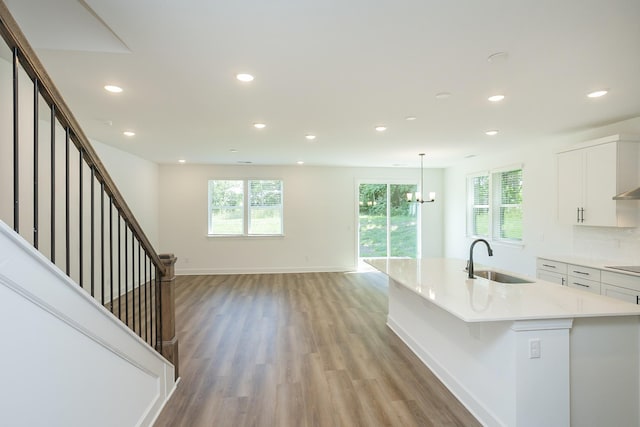 137 W Cassa Way, Mount Juliet, TN 37122 - kitchen featuring recessed lighting, light wood-style flooring, plenty of natural light, white cabinetry, and light countertops