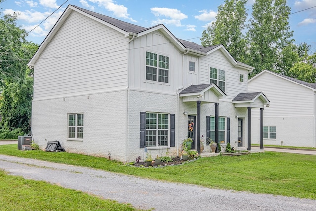 252 Caroline Dr Unit A, Murfreesboro, TN 37128 - view of front facade with brick siding, a front yard, and board and batten siding