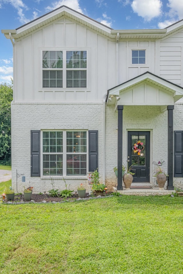 252 Caroline Dr Unit A, Murfreesboro, TN 37128 - view of front of property with a front lawn and board and batten siding
