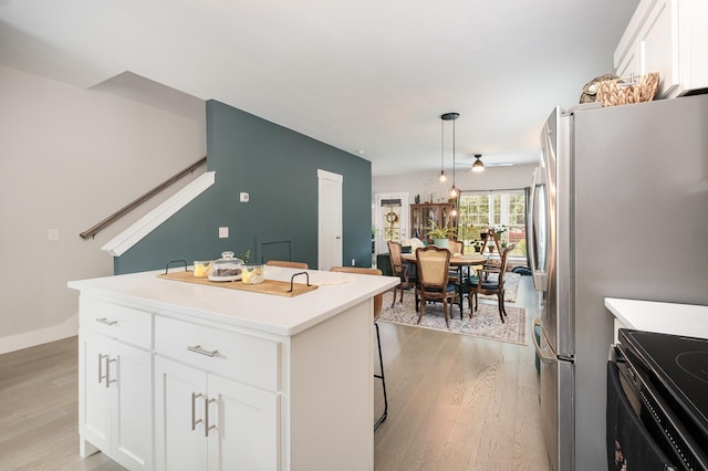 252 Caroline Dr Unit A, Murfreesboro, TN 37128 - kitchen featuring light wood finished floors, ceiling fan, white cabinets, and light countertops