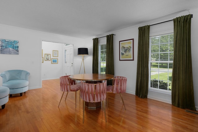 3351 Oak Burr Dr, Chattanooga, TN 37419 - dining space with plenty of natural light, light wood-type flooring, and crown molding