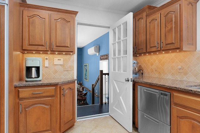 3351 Oak Burr Dr, Chattanooga, TN 37419 - kitchen featuring stainless steel dishwasher, tasteful backsplash, dark stone counters, brown cabinetry, and light tile patterned floors