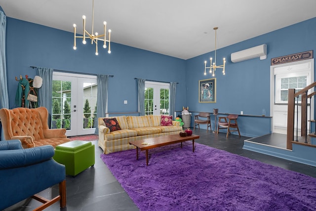 3351 Oak Burr Dr, Chattanooga, TN 37419 - living room featuring french doors, a chandelier, a wall mounted air conditioner, and concrete floors