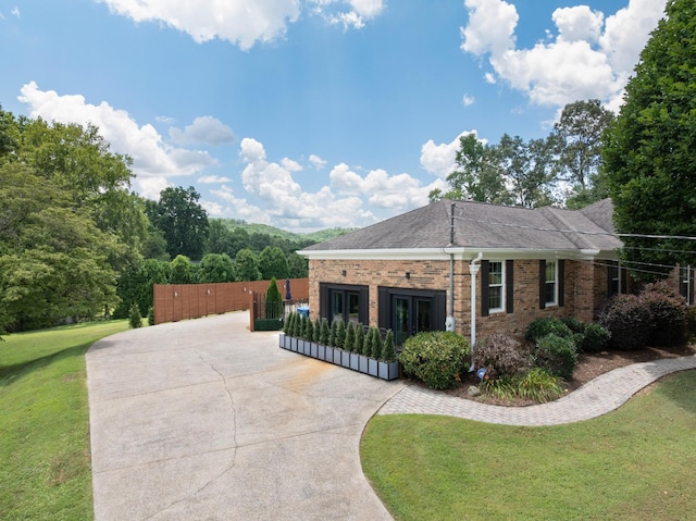3351 Oak Burr Dr, Chattanooga, TN 37419 - view of side of home with brick siding, concrete driveway, and roof with shingles