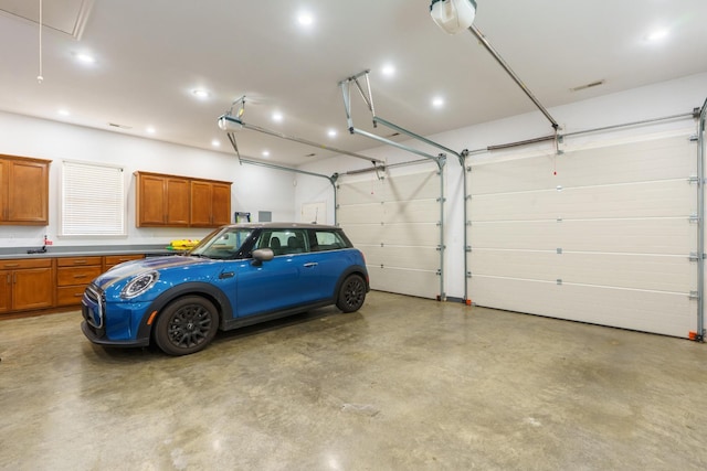 3351 Oak Burr Dr, Chattanooga, TN 37419 - garage featuring a garage door opener and recessed lighting