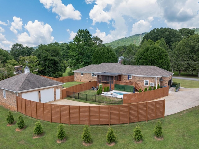 3351 Oak Burr Dr, Chattanooga, TN 37419 - rear view of property featuring a fenced backyard, brick siding, driveway, and a deck