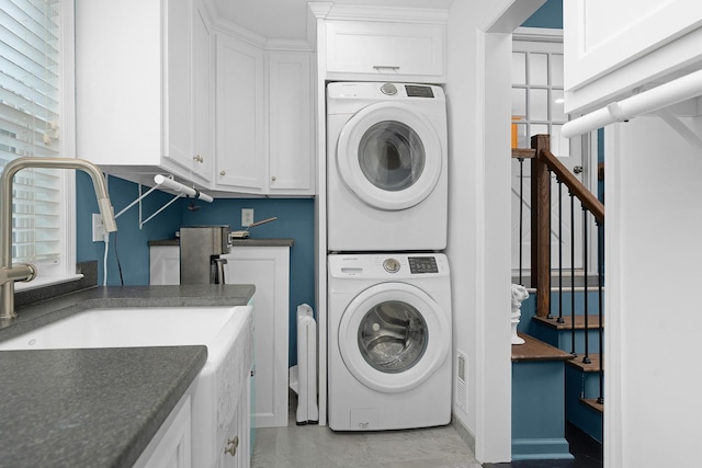 3351 Oak Burr Dr, Chattanooga, TN 37419 - washroom featuring estacked washer and dryer and cabinet space