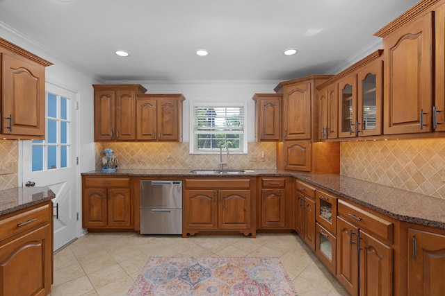 3351 Oak Burr Dr, Chattanooga, TN 37419 - kitchen featuring stainless steel dishwasher, tasteful backsplash, brown cabinets, dark stone countertops, and crown molding