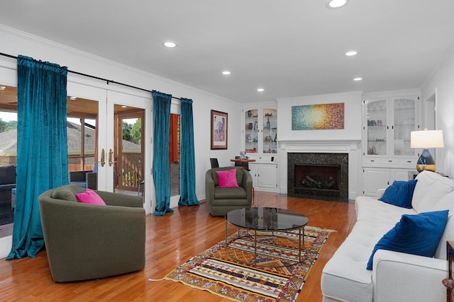 3351 Oak Burr Dr, Chattanooga, TN 37419 - living room featuring crown molding, wood finished floors, french doors, recessed lighting, and a fireplace with flush hearth