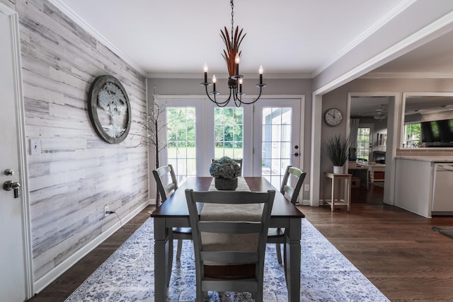 818 W Clark Blvd, Murfreesboro, TN 37129 - dining space with an accent wall, a chandelier, wooden walls, and dark wood-type flooring