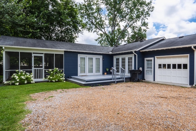 818 W Clark Blvd, Murfreesboro, TN 37129 - view of front of property with french doors, an attached garage, a wooden deck, gravel driveway, and a sunroom