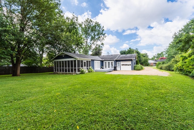 818 W Clark Blvd, Murfreesboro, TN 37129 - back of property featuring driveway, a sunroom, and an attached garage