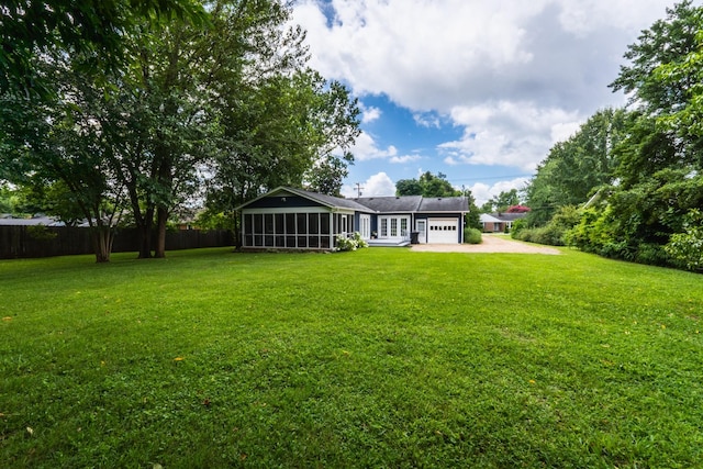 818 W Clark Blvd, Murfreesboro, TN 37129 - rear view of house with a sunroom, an attached garage, and driveway