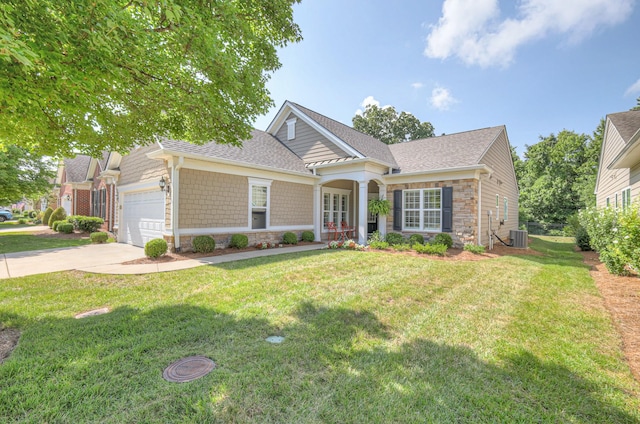 154 Salient Ln, Mount Juliet, TN 37122 - view of front of property featuring stone siding, an attached garage, a front yard, concrete driveway, and a shingled roof