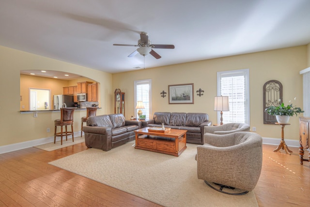 154 Salient Ln, Mount Juliet, TN 37122 - living room featuring light wood-style flooring, ceiling fan, and arched walkways