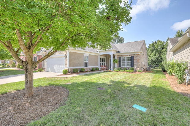 154 Salient Ln, Mount Juliet, TN 37122 - view of front of house featuring stone siding, a garage, a front lawn, and driveway