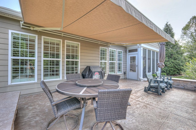 154 Salient Ln, Mount Juliet, TN 37122 - view of patio featuring outdoor dining area, area for grilling, and a sunroom