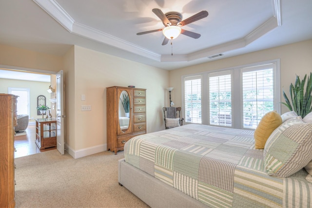154 Salient Ln, Mount Juliet, TN 37122 - bedroom with a tray ceiling, multiple windows, crown molding, light colored carpet, and a ceiling fan