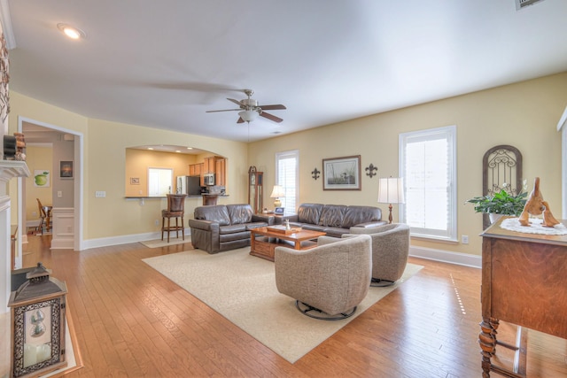 154 Salient Ln, Mount Juliet, TN 37122 - living area featuring ceiling fan, arched walkways, light wood-style flooring, recessed lighting, and a fireplace