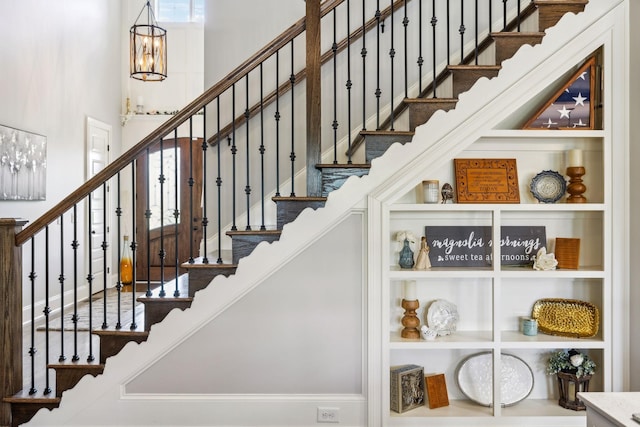 1300 Stovall Ln, Mount Juliet, TN 37122 - staircase with a high ceiling and a chandelier