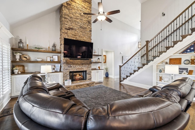 1300 Stovall Ln, Mount Juliet, TN 37122 - living room featuring a fireplace, high vaulted ceiling, ceiling fan, dark wood-type flooring, and stairway